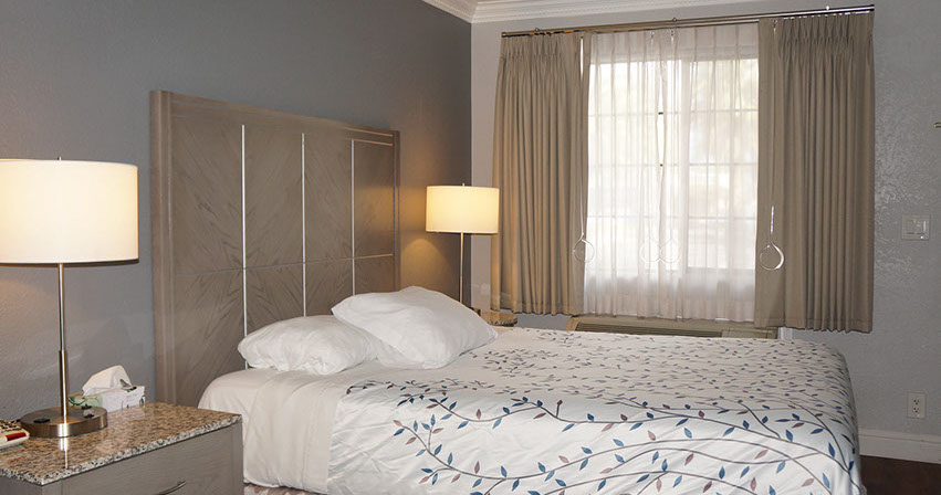 Rest in comfort in our queen room. 1 queen bed, night stands, lamps and direct dial hone.